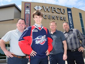 Windsor, Ontario. June 18, 2019. Wyatt Johnston, Windsor Spitfires first-round draft pick in 2019 OHL draft, introduced by GM Warren Rychel, right, Coach Trevor Letowski and Spits VP Bill Bowler, left, Tuesday.