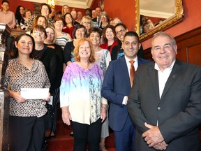 WFCU Credit Union executives Marty Gillis, right, and Eddie Francis gather with recipients of the 2019 Community Donations Fund at Willistead Manor Friday. An integral part of WFCU Credit Union's community engagement program, Inspire, the Community Donations Fund is dedicated to assisting community organizations across Windsor-Essex County in delivering programs and projects for the betterment of the community. In front row, Lariza Mendoza, left, of the Mirgrant Worker Community Program and Debbie Clark of the Windsor Lawn Bowling Club and dozens of others representing area groups, behind, join Francis and Gillis for the group photo.