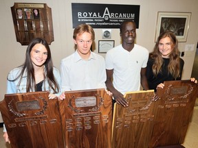 Windsor, Ontario. June 21, 2019 --  Royal Arcanum recipients Kim Orton, Essex, left, Spencer Campeau, Essex, Akot Aken, Kennedy and Alessandra Pontoni, Sandwich, right, receive their awards at Windsor Sportsmen's Club Friday.  See story by Jim Parker.