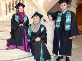 Windsor Islamic High School graduates Dania Zeidan, left, Javeria Abdul Salam and Mohammad Al-Kawadri, right, gather at Ciociaro Club of Windsor for the high school's first ever graduating celebration. Windsor Islamic High School currently have 26 students, with six graduating and moving on to their post-secondary studies.