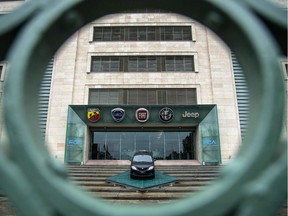 The logos of automobile companies, Abarth, Lancia, Fiat, Alfa Romeo and Jeep are pictured at the entrance to the Fiat Chrysler Automobiles ,FCA, at the Fiat Mirafiori car plant on May 27, 2019 in Turin, northern Italy.