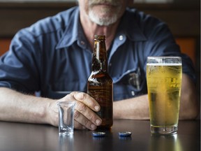 A man drinks a beer in a Windsor bar. A significant number of COVID-19 cases stemming from local businesses and weddings lax on pandemic restrictions has prompted a crackdown from the local health unit.