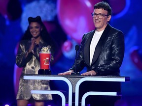 Producer Anthony Russo accepts the Best Movie award for 'Avengers: Endgame' from Tessa Thompson, left, onstage during the 2019 MTV Movie and TV Awards at Barker Hangar on June 15, 2019 in Santa Monica, Calif. (Kevin Winter/Getty Images for MTV)