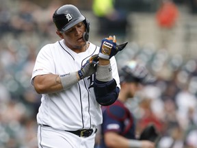 Detroit Tigers first baseman Miguel Cabrera looks at the side of his hand after being hit by a pitch against the Minnesota Twins during the sixth inning at Comerica Park.