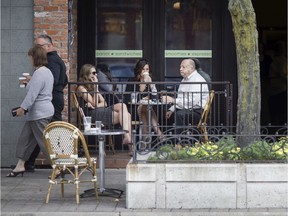 Patrons sit outside the Coffee Exchange in downtown Windsor, Wednesday, September 26, 2018.