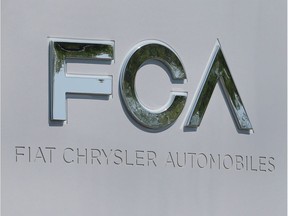 A Fiat Chrysler Automobiles (FCA) sign is seen at its U.S. headquarters in Auburn Hills, Michigan on May 25, 2018.