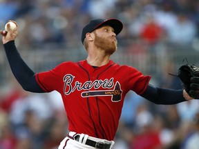 Atlanta Braves starting pitcher Mike Foltynewicz works against the Detroit Tigers in the first inning of a baseball game Friday, May 31, 2019, in Atlanta.