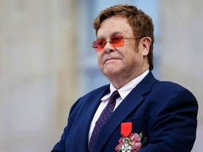 British singer-songwriter Elton John addresses a crowd in the courtyard of the Elysee Palace in Paris, on June 21, 2019, as part of a ceremony in which he was awarded the French Legion of Honour from the French president and concerts to mark France's annual "Fete de la Musique" (Music Festival). (LEWIS JOLY/AFP/Getty Images)