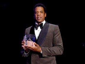 NEW YORK, NY - JANUARY 27: Honoree Jay-Z accepts the President's Merit Award onstage during the Clive Davis and Recording Academy Pre-GRAMMY Gala and GRAMMY Salute to Industry Icons Honoring Jay-Z on January 27, 2018 in New York City.