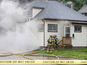 Windsor firefighters deal with a incident in the attic of a home at 2275 Highland Ave. on June 20, 2019.