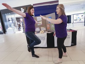 Altered senses. The Brain Injury Association of Windsor and Essex County is hosting an information and interactive booth over the weekend at Devonshire Mall. Here, at a news conference on June 7, 2019, Kate Turner, left, and Meghan Fyall, conduct a balancing exercise which simulates brain injury symptoms.