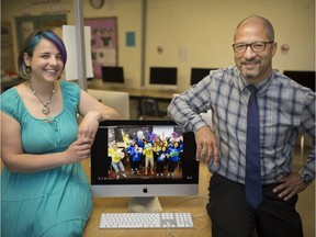 Megan Simon, left, media arts teacher at Kennedy Collegiate Institute, is pictured with the outgoing principal, Josh Canty, with a video she created for his departure, Friday, June 21, 2019.