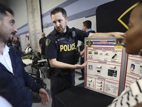 Local emergency services organizations participated in an event on June 10, 2019, to introduce new Canadians to their members and display what type of work and help they offer. The event was held at the Major FA Tilston Armoury & Police Training Centre in Windsor. OPP Const. Matt Lupton speaks to attendees about street drugs during the event.