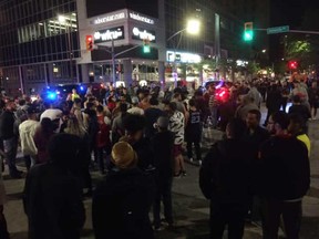 Celebrants fill the intersection of Ouellette Avenue and University Avenue in downtown Windsor following the Game 6 victory of the Toronto Raptors - clinching the NBA championships on June 13, 2019.