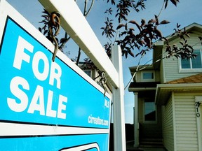 A for sale sign sits outside this home in Coventry Hills.