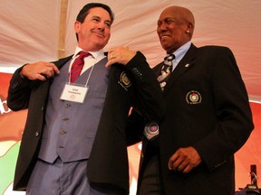 Fergie Jenkins presents Rob Thomson with his Canadian Baseball Hall of Fame jacket Saturday in St. Marys. Cory Smith/The Beacon Herald