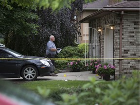 An investigator with the Special Investigations Unit works at the scene of a police-involved fatal shooting of a 48-year-old male at 605 Estate Park in Tecumseh, Saturday, June 15, 2019.  The shooting occurred late last night.