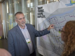 Pat Delmore, executive director of Transit Windsor,  discusses proposals for the More Than Transit project during an open house at City Hall, Wednesday, June 19, 2019.