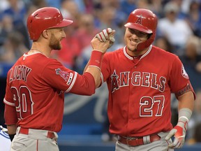 Los Angeles Angels center fielder Mike Trout, right, is greeted by catcher Jonathan Lucroy after hitting a grand slam home run against Toronto Bue Jays in the fourth inning at Rogers Centre. (Dan Hamilton-USA TODAY Sports)
