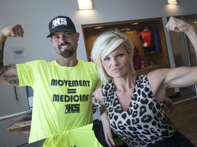 Kyle Essery, left, a personal coach and trainer and owner of Healthy Solutions, and Joanna Conrad, director at Youth Diversion, are pictured at GoodLife Fitness, Thursday, June 27, 2019.