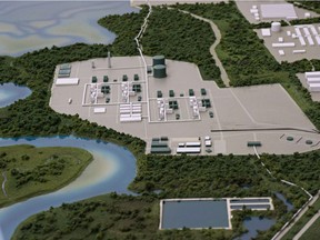 A model at the LNG Canada offices in Kitimat, B.C., shows the proposed liquified natural gas liquification plant and marine terminal, June 26, 2014. The Rio Tinto Alcan smelter is in the background .