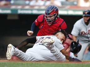 Roberto Perez of the Cleveland Indians tags out Victor Reyes of the Detroit Tigers attempting to score on a double by Harold Castro #30 during the first inning at Progressive Field on July 15, 2019 in Cleveland, Ohio.