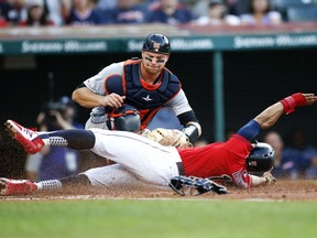 Francisco Lindor of the Cleveland Indians is tagged out by John Hicks of the Detroit Tigers attempting to steal home during the third inning at Progressive Field on July 17, 2019 in Cleveland, Ohio.