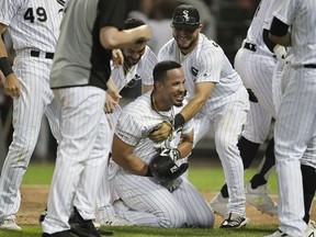 Jose Abreu of the Chicago White Sox celebrates with teammates after hitting a walk-off home run in the 12th inning against the Detroit Tigers during game two of a double header at Guaranteed Rate Field on July 03, 2019 in Chicago, Illinois.