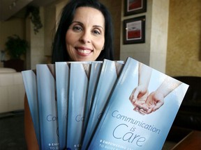 Windsor author Jennifer George is shown on July 26, 2019, with her book, Communication is Care, which focuses on changing the conversation on health care.