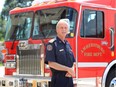 Amherstburg Fire Chief Bruce Montone poses with the service's 1995 Fort Garry-built fire engine which weighs 20 tonnes.  Once the pumper is re-equipped, it will be moved to Boblo Island using the Boblo Island ferry. Lake level conditions will dictate when the move takes place.