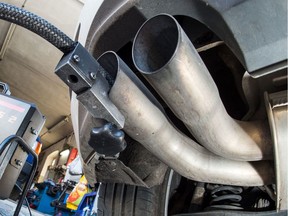(FILES) This file photo taken on October 01, 2015 shows a measuring hose for emissions inspections in diesel engines sticks in the exhaust tube of a Volkswagen (VW) Golf 2,0 TDI diesel car at a garage in Frankfurt an der Oder, eastern Germany.  Around 630,000 Audi, Mercedes, Opel, Porsche and Volkswagen cars are to be recalled in Europe owing to irregularities in their emission of pollutants, a German government source told AFP on April 22, 2016.