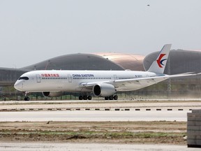 (FILES) In this file photo taken on May 13, 2019 a China Eastern Airlines Airbus A350-900 taxis during flight tests at the new Beijing Daxing International Airport in Beijing. - Beijing is set to open an eye-catching multi-billion dollar airport resembling a massive shining starfish, to accommodate soaring air traffic in China and celebrate the Communist government's 70th anniversary in power.