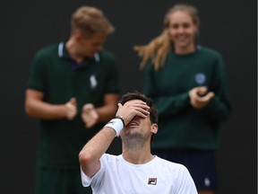 Argentina's Guido Pella celebrates after beating Canada's Milos Raonic during their men's singles fourth round match on the seventh day of the 2019 Wimbledon Championships at The All England Lawn Tennis Club in Wimbledon, southwest London, on July 8, 2019.