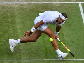 Spain's Rafael Nadal returns against US player Sam Querrey during their men's singles quarter-final match on day nine of the 2019 Wimbledon Championships at The All England Lawn Tennis Club in Wimbledon, southwest London, on July 10, 2019.