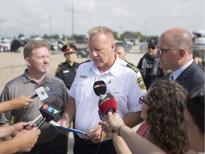 Harbour Master, Peter Berry, reads the details of a Traffic Control Zone order, which prohibits motorized boaters within 30 metres from the shore, during a press conference at Lakeview Park Marina on July 12,  2019.