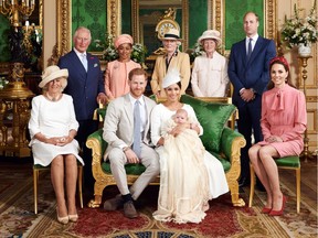 This official christening photograph released by the Duke and Duchess shows Prince Harry, Duke of Sussex and Meghan, Duchess of Sussex with their son, Archie and the Duchess of Cornwall, Britain's Prince Charles, Prince of Wales, Ms Doria Ragland, Lady Jane Fellowes, Lady Sarah McCorquodale, Prince William, Duke of Cambridge and Catherine, Duchess of Cambridge in the Green Drawing Room at Windsor Castle, near London, Britain, July 6, 2019.