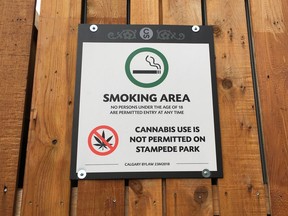 A sign is posted on a fence in the concessions area banning the use of cannabis on the grounds during the Calgary Stampede in Calgary, July 5, 2019.