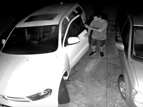 An image from a surveillance camera video shared by Windsor Mayor Drew Dilkens showing an alleged theft from the mayor's vehicle during the early morning hours of July 17, 2019.