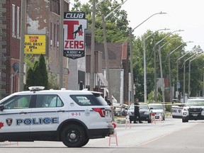 Windsor police units close the 1600 block of Drouillard Road while officers search for evidence of shots fired on July 9, 2019.