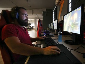 Jarrod Ferris, a customer at new Windsor video gaming lounge EZY Mode (943 Ottawa St.), plays a round of Overwatch on July 23, 2019.