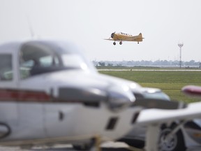 A vintage airplane takes off at the Windsor Flying Club's Fly-In Festival at the Windsor International Airport, Saturday, July 6, 2019.