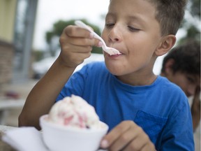 Cylas Laurent, 8, beats the heat with some strawberry shortcake ice cream at Stop 26 in East Windsor, Thursday, July 18, 2019. Temperatures will approach record high levels in the coming days.
