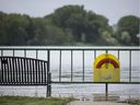 Record high water levels, like here on Thursday with the Detroit River shown to be breaching the walkway at Gil Maure Park in LaSalle, are causing shoreline property damage.