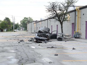 The wreckage of a black BMW that Windsor police say burst into flames after a crash at Howard Avenue and McDougall Street early July 28, 2019.