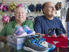 Jacka nd Arnie Blaine, owners of Karen's 4or Kids, are pictured at the store on July 22, 2019.  The Ottawa Street shop is closing after 72 years in business.