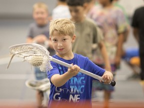 Summer camp fun. Carson Brown, 7, takes part in the lacrosse portion at Camp Migizi at the St. Denis Centre on July 11, 2019.