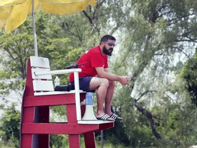 Andrew Dennison, a lifeguard at Sandpoint Beach in Windsor, keeps an eye on things during his shift on Tuesday, July 9, 2019.
