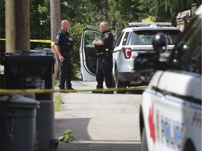 Windsor police officers are shown in an alley in the 800 block of Lincoln Road in Old Walkerville on Wednesday, July 3, 2019, where they were investigating a stabbing incident.