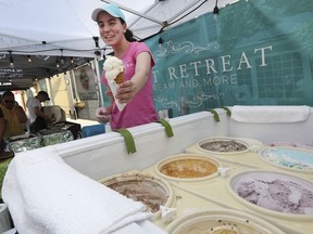 Icy treat on a steamy hot summer's night. Elizabeth Nelson of Sweet Retreat serves up some ice cream during the July 5, 2019, edition of The Mill Street Market, a monthly event in Leamington featuring specially curated street foods, handcrafted items, vintage clothing and antiques. The next Mill Street night market in August 9.