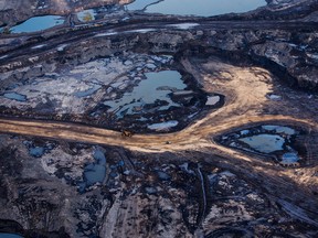 The Suncor Energy Inc. Millennium mine is seen in this aerial photograph taken above the Athabasca oilsands near Fort McMurray, Alberta.